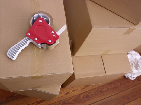 Expert packers organizing fragile items during a Bermondsey relocation