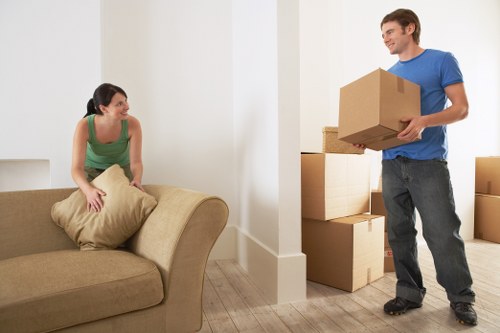 Packing boxes and furniture for Bermondsey removals in a residential property